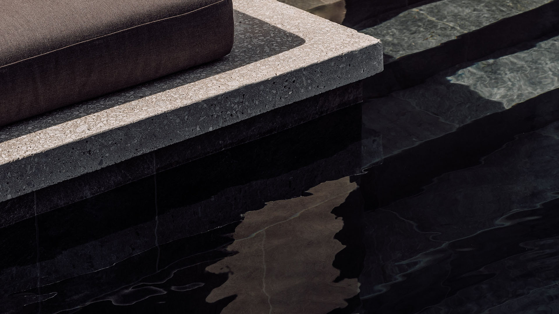 Stone steps leading into spa setting, calm and tactile design element